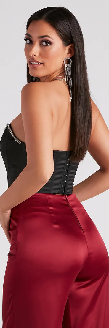The Cause For Rhinestone Trim Bustier in black is a sequin top with an all-over sparkle, perfect for creating a glam concert outfit or adding shimmer to a going-out look. 