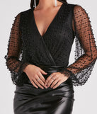 The Luxe Be A Lady Faux Pearl Bodysuit is a women's black long-sleeve top with an elevated style and unique design accents, perfect for layering or transitioning into colder months.