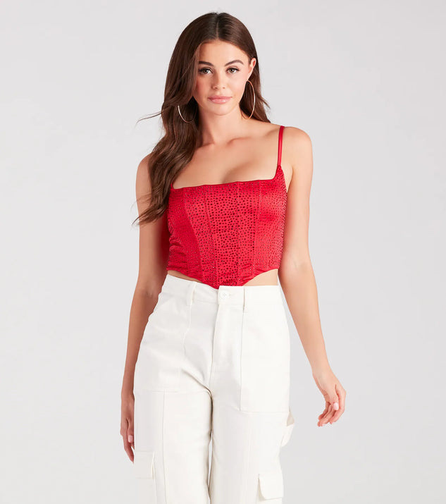 The waist-defining bodice style of the Heat Of The Moment Rhinestone Satin Corset Top in red is perfect for making a statement with your outfit and provides the structure, molded cups, or lace-up details that capture the corset trend.