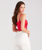 The party-ready Heat Of The Moment Rhinestone Satin Corset Top is a red going-out top showcasing a seasonal color and modern silhouette to create outfits for date nights, cocktail parties, or clubwear.