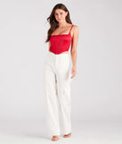 The waist-defining bodice style of the Heat Of The Moment Rhinestone Satin Corset Top in red is perfect for making a statement with your outfit and provides the structure, molded cups, or lace-up details that capture the corset trend.