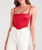 The waist-defining bodice style of the Heat Of The Moment Rhinestone Satin Corset Top in red is perfect for making a statement with your outfit and provides the structure, molded cups, or lace-up details that capture the corset trend.