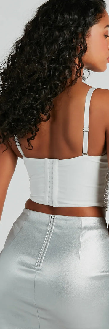 The Feeling Bold Faux Pearl Rhinestone Bustier in ivory is a sequin top with an all-over sparkle, perfect for creating a glam concert outfit or adding shimmer to a going-out look. 