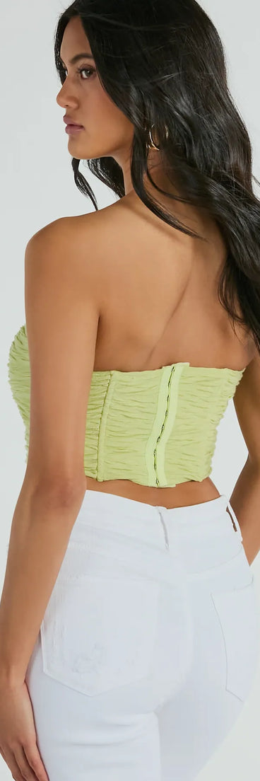 The party-ready In The Spotlight Strapless Ruched Corset Top is a sage green going-out top showcasing a seasonal color and modern silhouette to create outfits for date nights, cocktail parties, or clubwear.