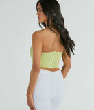 The party-ready In The Spotlight Strapless Ruched Corset Top is a sage green going-out top showcasing a seasonal color and modern silhouette to create outfits for date nights, cocktail parties, or clubwear.