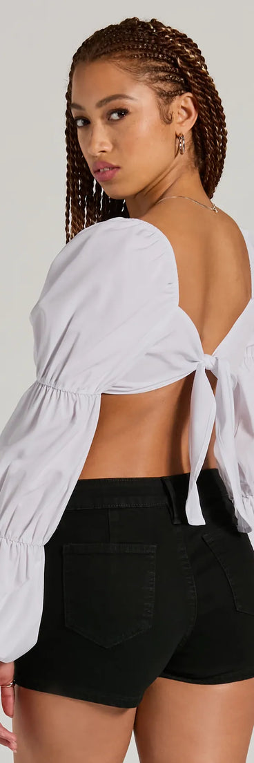 The Official Cutie Tie Back Long Sleeve Crop Top is a women's long-sleeve top with an elevated style and unique design accents, perfect for layering or transitioning into colder months.