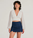 The Chic Credentials Long Sleeve Open Back Chiffon Top in ivory with a modern design and trendy look is part of the latest women's tops collection to elevate your 2025 wardrobe.