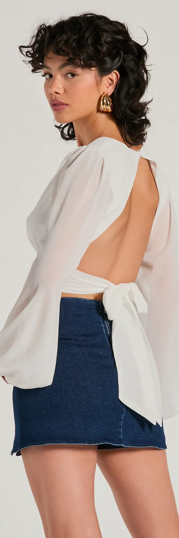 The Chic Credentials Long Sleeve Open Back Chiffon Top is a women's ivory long-sleeve top with an elevated style and unique design accents, perfect for layering or transitioning into colder months.