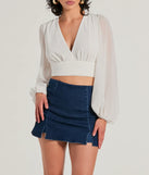 The Chic Credentials Long Sleeve Open Back Chiffon Top is a women's ivory long-sleeve top with an elevated style and unique design accents, perfect for layering or transitioning into colder months.