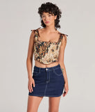 The waist-defining bodice style of the Charming Essence Satin Bow Floral Corset Top in brown is perfect for making a statement with your outfit and provides the structure, molded cups, or lace-up details that capture the corset trend