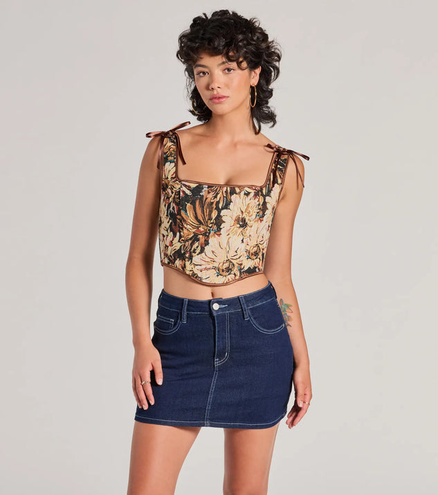 The waist-defining bodice style of the Charming Essence Satin Bow Floral Corset Top in brown is perfect for making a statement with your outfit and provides the structure, molded cups, or lace-up details that capture the corset trend