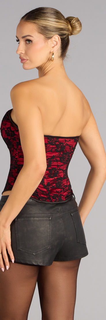 Sculpted to flatter, the Queen Of Midnight Lace Corset Top is a red corset top that creates a sleek sillhouette and brings trend-forward style to any look.
