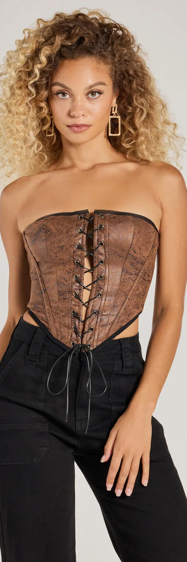 The Smooth And Edgy Lace-Up Faux Suede Corset Top in brown with a modern design and trendy look is part of the latest women's tops collection to elevate your 2025 wardrobe.