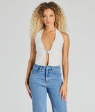 The Sultry Trend Buckle Strap Halter Crop Top in ivory brings edge and energy to your vibe, ready to elevate any festival look or concert outfit.