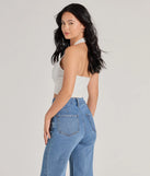 The Edgy Vibe Buckle Detail Halter Crop Top in ivory with a modern design and trendy look is part of the latest women's tops collection to elevate your 2025 wardrobe.
