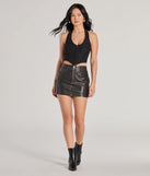 The waist-defining bodice style of the Edgy Chic Cropped Corset Halter Top in black is perfect for making a statement with your outfit and provides the structure, molded cups, or lace-up details that capture the corset trend.