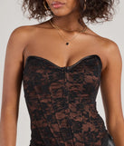 The waist-defining bodice style of the Queen Of Midnight Lace Corset Top in brown is perfect for making a statement with your outfit and provides the structure, molded cups, or lace-up details that capture the corset trend.