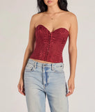 The Chic Status Brocade Satin Strapless Corset Top in burgundy with a modern design and trendy look is part of the latest women's tops collection to elevate your 2025 wardrobe.