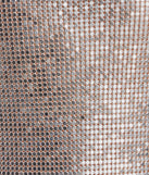 The Go For Glitz Rhinestone Chainmail Hanky Top in silver is a holiday-ready sequin top with an all-over sparkle, perfect for creating a glam NYE outfit or adding shimmer to a festive holiday look. 