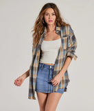 The Casual Staple Plaid Flannel Top in blue with a modern design and trendy look is part of the latest women's tops collection to elevate your 2025 wardrobe.