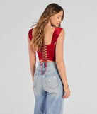 With its midriff cut and trend-forward fit, the Renaissance Spell Lace-Up Satin Corset is a red crop top made to pair with skirts, denim, or whatever vibe you're feeling this season.