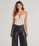 The All That Glam Rhinestone Satin Cropped Corset in ivory with a modern design and trendy look is part of the latest women's tops collection to elevate your 2025 wardrobe.