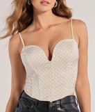 The waist-defining bodice style of the All That Glam Rhinestone Satin Cropped Corset in ivory is perfect for making a statement with your outfit and provides the structure, molded cups, or lace-up details that capture the corset trend.