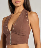 With its midriff cut and trend-forward fit, the Absolute Edge Halter Grommet Zip-Up Crop Top is a brown crop top made to pair with skirts, denim, or whatever vibe you're feeling this season.
