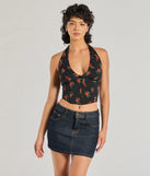 The Charming Ditsy Rose Lace-Up Halter Corset Top in black brings edge and energy to your vibe, ready to elevate any festival look or concert outfit.