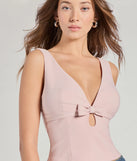 Stay on-trend this season with the Sweet Charm Bow-Front Tank Top in pink, a must-have for creating stylish and effortless spring outfits for women.