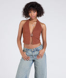 From bold to effortless, the Sultry Trend Buckle Strap Halter Crop Top lets you define your vibe with rust tops that speak your style.