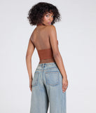With its midriff cut and trend-forward fit, the Sultry Trend Buckle Strap Halter Crop Top is a rust crop top made to pair with skirts, denim, or whatever vibe you're feeling this season.