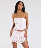 From bold to effortless, the Call Me Cutie Lace-Up Floral Eyelet Corset Top lets you define your vibe with white tops that speak your style.