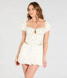 Stay on-trend this season with the Sweet Days Floral Eyelet Lace-Up Bustier in ivory, a must-have for creating stylish and effortless spring outfits for women.