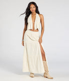 The Constant Stunner Open Back Halter Crop Top in beige brings edge and energy to your vibe, ready to elevate any festival look or concert outfit.
