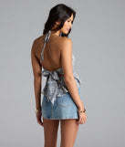 The Breezy Cutie Paisley Halter Babydoll Top in navy blue brings edge and energy to your vibe, ready to elevate any festival look or concert outfit.