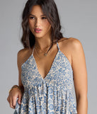 The Breezy Cutie Paisley Halter Babydoll Top in navy blue brings edge and energy to your vibe, ready to elevate any festival look or concert outfit.