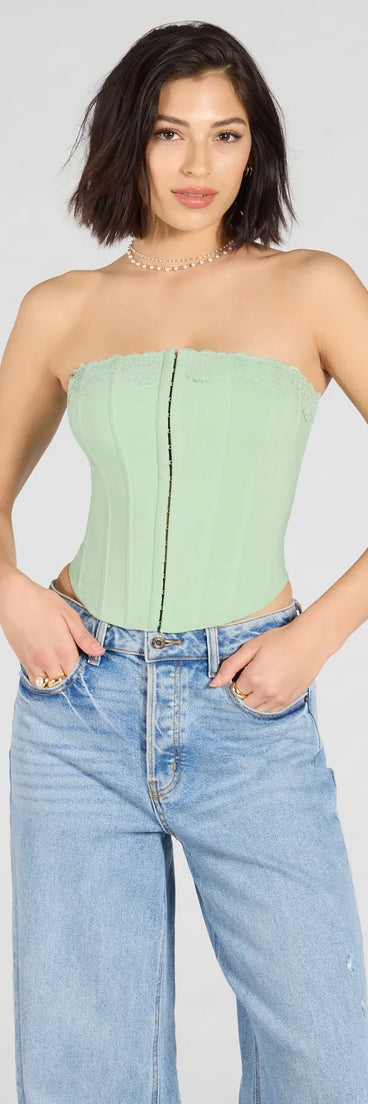 Trendy women’s tops in sage green, like the Chic And Snatched Strapless Lace Trim Corset Top, bring effortless style for fall layering, lounging, or going out.