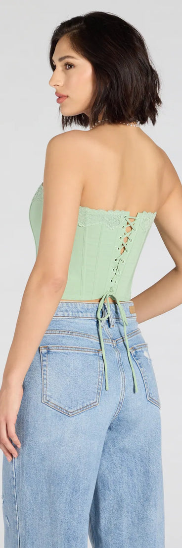 For college campus looks, game day outfits, or a bold going-out vibe, the Chic And Snatched Strapless Lace Trim Corset Top is an on-trend sage green crop top that easily styles with your favorite denim.