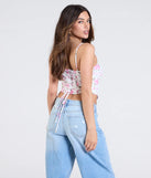 From bold to effortless, the Cheerful Blooms Floral Lace-Up Eyelet Bustier lets you define your vibe with white tops that speak your style.
