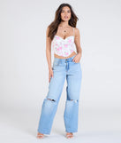 From bold to effortless, the Cheerful Blooms Floral Lace-Up Eyelet Bustier lets you define your vibe with white tops that speak your style.