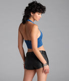 The Buckled Babe Halter Denim Crop Top in denim blue brings edge and energy to your vibe, ready to elevate any festival look or concert outfit.