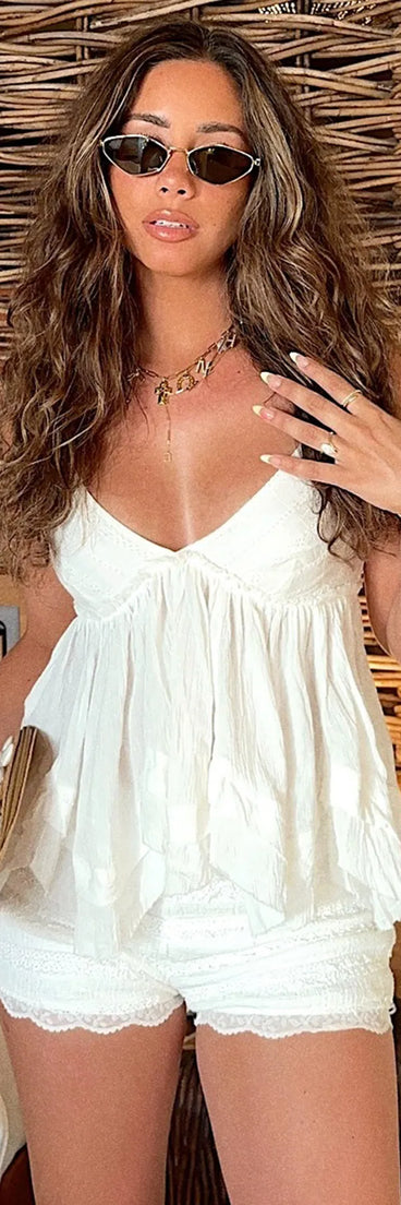 For college campus looks, game day outfits, or a bold going-out vibe, the By The Beach V-Neck Halter Babydoll Crop Top is an on-trend white crop top that easily styles with your favorite denim.