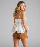 With its midriff cut and trend-forward fit, the By The Beach V-Neck Halter Babydoll Crop Top is a white crop top made to pair with skirts, denim, or whatever vibe you're feeling this season.