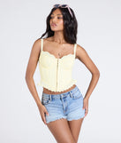 Stay on-trend this season with the Ray Of Sunshine Eyelet Lace Bustier in yellow, a must-have for creating stylish and effortless spring outfits for women.
