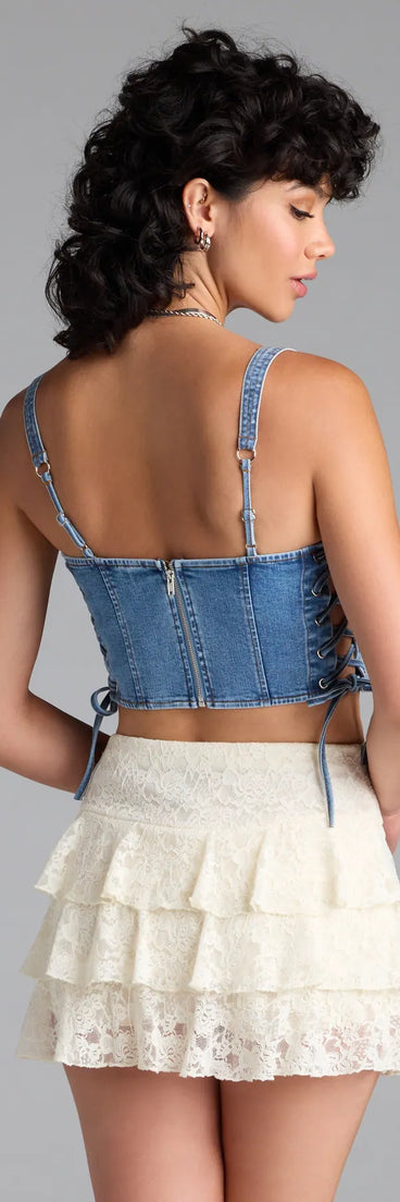 The Popular Icon Lace-Up Denim Corset Top in denim blue brings edge and energy to your vibe, ready to elevate any festival look or concert outfit.