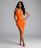 Step into summer looking effortlessly chic in the Toasty Sweetheart V-Neck Bodycon Knit Midi Dress in orange, a must-have Windsor dress for your warm-weather wardrobe.
