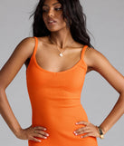 Step into summer looking effortlessly chic in the Toasty Sweetheart V-Neck Bodycon Knit Midi Dress in orange, a must-have Windsor dress for your warm-weather wardrobe.