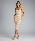 The Curve Avenue Halter V-Neck Bodycon Midi Dress in beige features a flattering fit and mid-calf hem, redefining effortless midi dresses for any occasion.