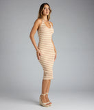The Curve Avenue Halter V-Neck Bodycon Midi Dress in beige features a flattering fit and mid-calf hem, redefining effortless midi dresses for any occasion.